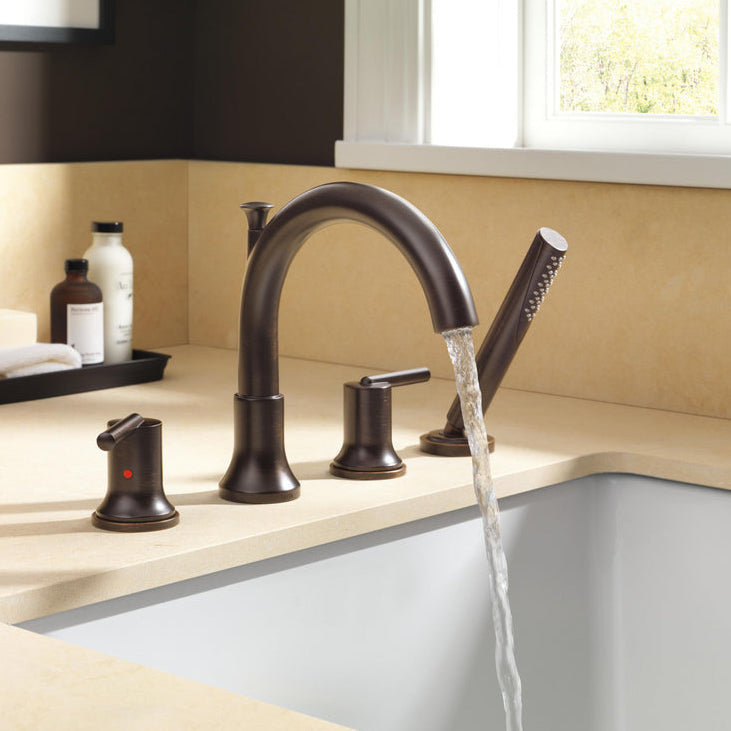 Delta Trinsic Roman tub filler with hand shower running