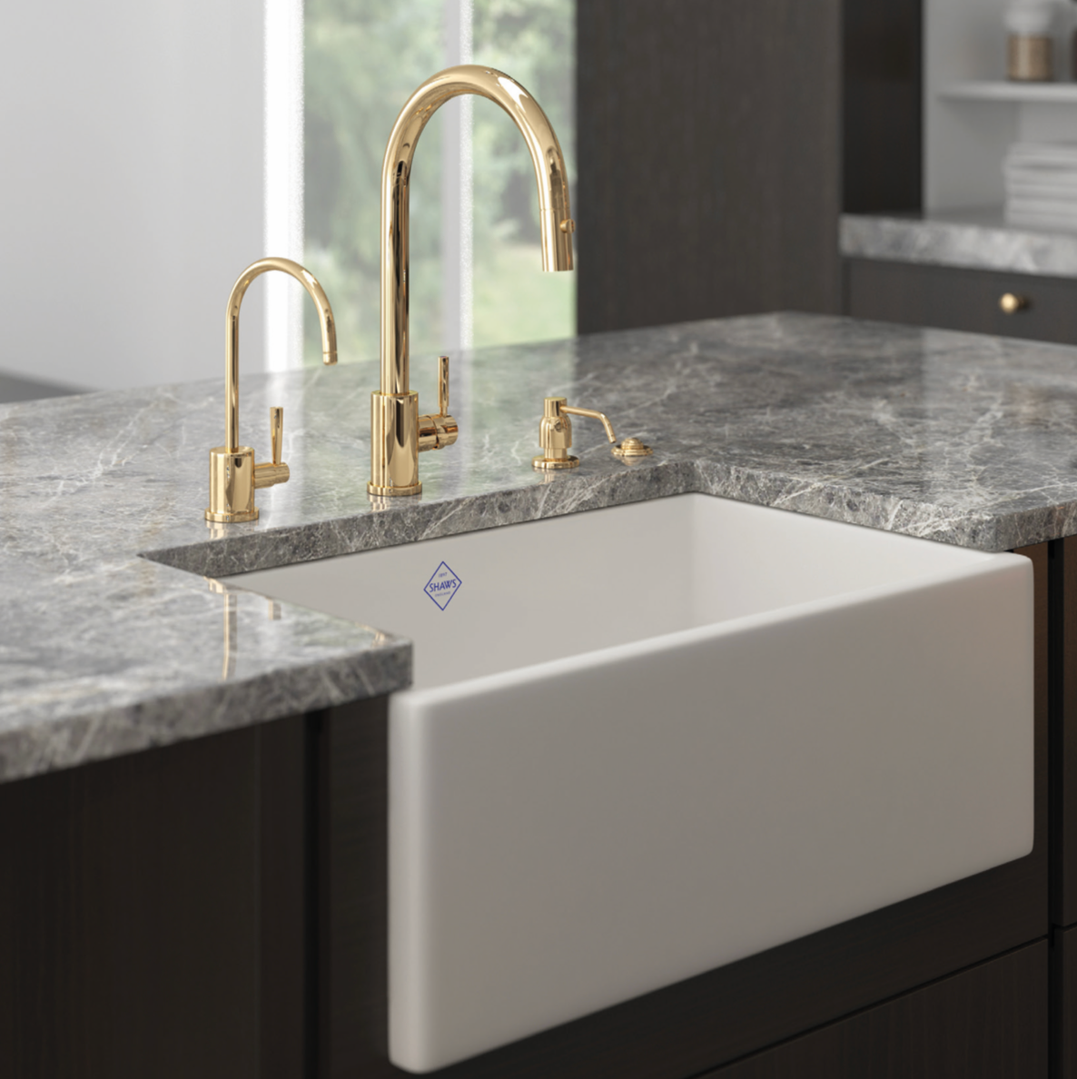 White kitchen sink with gold faucet in a modern kitchen setting